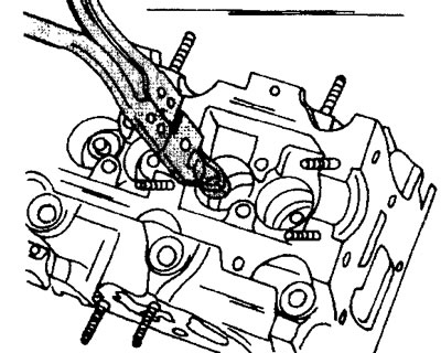 6.9 Remove the valve stem oil seals
