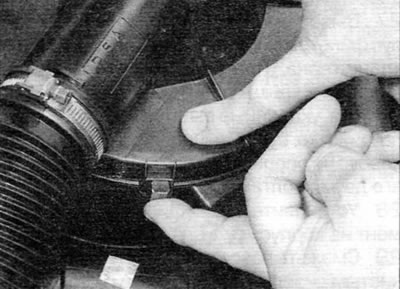 Figure 20.2, a. Release the clamps securing the cover to the filter housing...