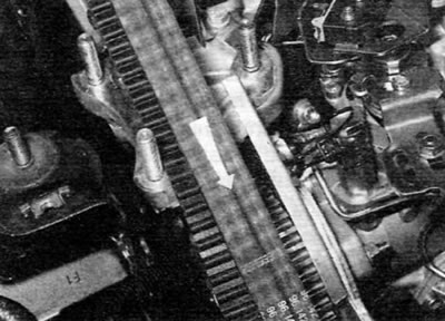 Figure 7.10, a. Mark the timing belt with an arrow indicating the direction of rotation
