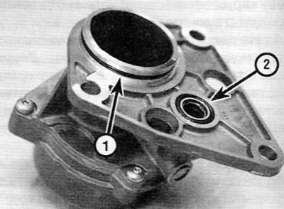 Figure 16.18. Left camshaft oil seal (1) and oil feed gallery sealing ring (2) on the rear of the…