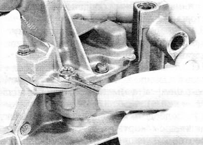 Figure 15.6, a. Remove the bolts...