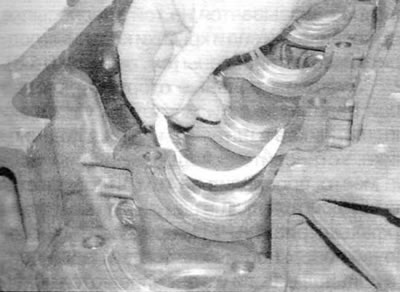 Figure 18.3. Install the upper thrust washers onto main bearing No. 2 with the oil groove facing…