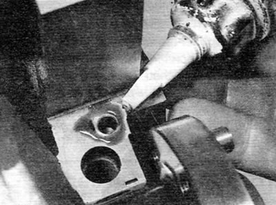 Figure 18.8. Applying sealant to the cylinder block surface mating with main bearing cap No. 1