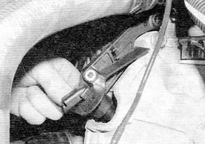 Figure 13.52, b....then remove the crankshaft position sensor from the front of the clutch housing