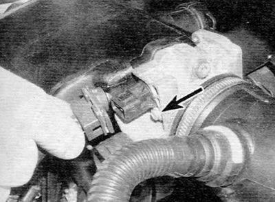 Figure 13.56, a. Disconnect the electrical connector and then remove the screw (marked with an…
