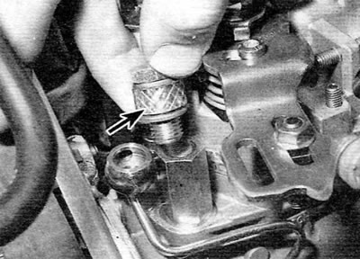 Figure 5.9, b. Installing the fuel supply line banjo bolt with a small piece of fuel hose (marked…