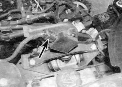 Figure 13.11. Disconnect the electrical connectors (marked with arrows) on the back of the high…