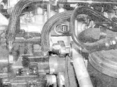 Figure 13.41. When connecting a new high-pressure fuel line to the pump and fuel rail, hold the…