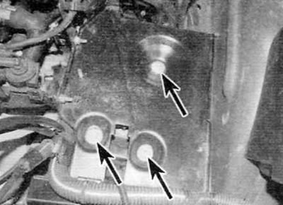 Figure 5.5. Remove the bolts (marked with arrows) fastening the backing plate to the top of the…