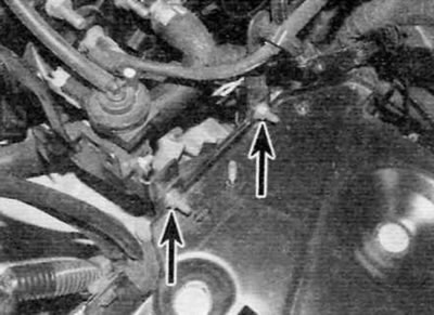 Figure 5.6. On diesel models, loosen the nuts and remove the bolts (marked with arrows) and remove…
