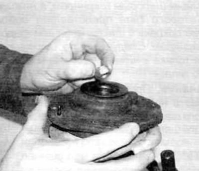 Figure 5.8, l....and then screw on and tighten the piston rod nut