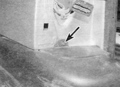 Figure 7.6. Remove the screw (marked with an arrow) on each side at the base there is a place for…
