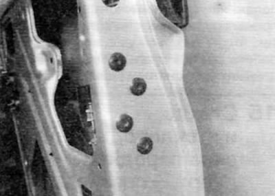 Figure 14.12. Remove the four bolts securing the lock assembly to the door