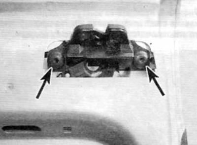 Figure 14.19. Remove the two screws securing the door latch