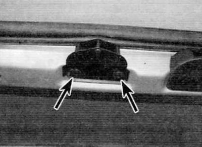 Figure 14.23. Bolts for fastening the mating part of the latch (marked with arrows)