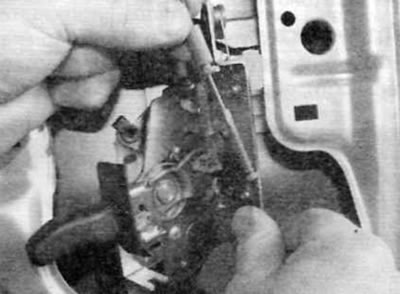 Figure 14.15, b....then disconnect the cables from the door lock levers