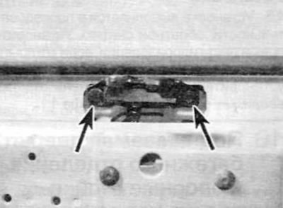 Figure 17.6, a. Remove two screws (marked with arrows)...