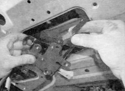 Figure 17.7, b....then remove the lock through the opening in the tailgate and disconnect the…