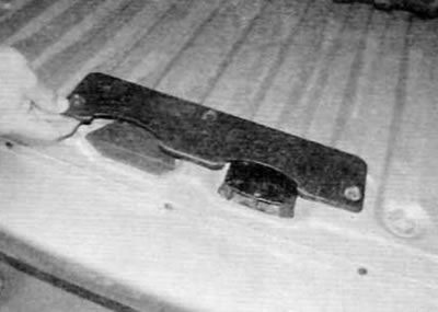 Figure 17.10. Remove the three screws and lift the lock's mating cover off the floor