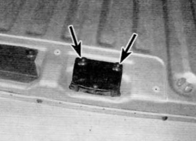 Figure 17.11. Remove two bolts (marked with arrows) and remove the mating part of the lock from the…