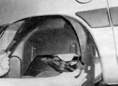Figure 23.6, b....and remove the fender from under the wheel arch