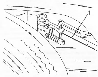 Figure 121. Installing a puller on the steering tip to separate it from the steering knuckle arm.