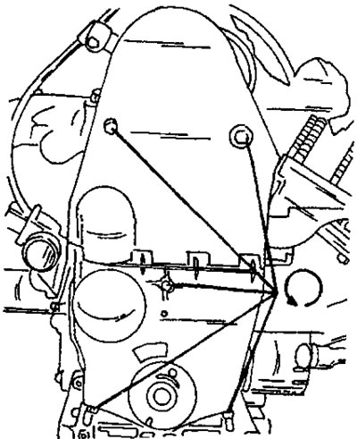 Рис. 44. Стрелками указано расположение болтов крепления защитного кожуха зубчатого ремня.