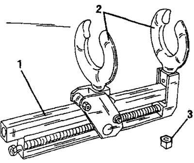 Рис. 216. Специальное приспособление для сжатия пружин для разборки амортизационной стойки. 1.…