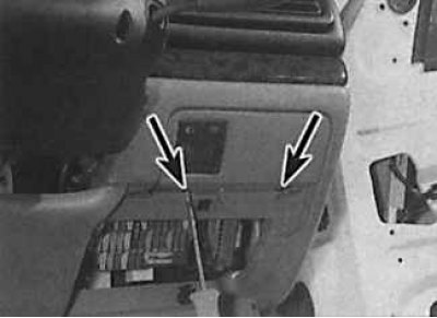 2. Unscrew the screws (indicated by arrows) fastening the base of the switch group.