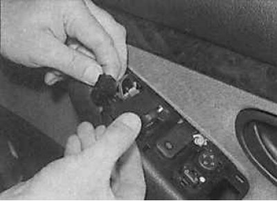 2. Use a lever to remove the switch from its socket on the door (photo on the left) and disconnect…
