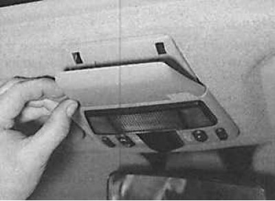 1. Remove the cover from the rear of the overhead console.