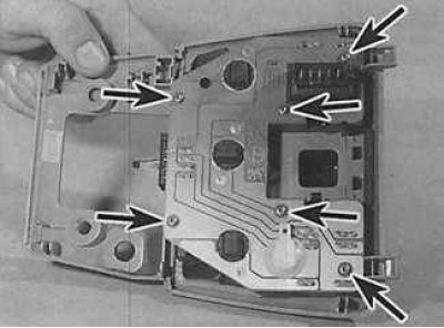 4. To remove the sunroof switch, unscrew the screws (indicated by arrows in the photo on the left)…
