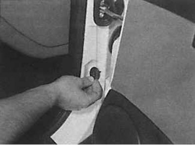 1. Open the door and remove the rubber boot from the switch located on the door pillar.